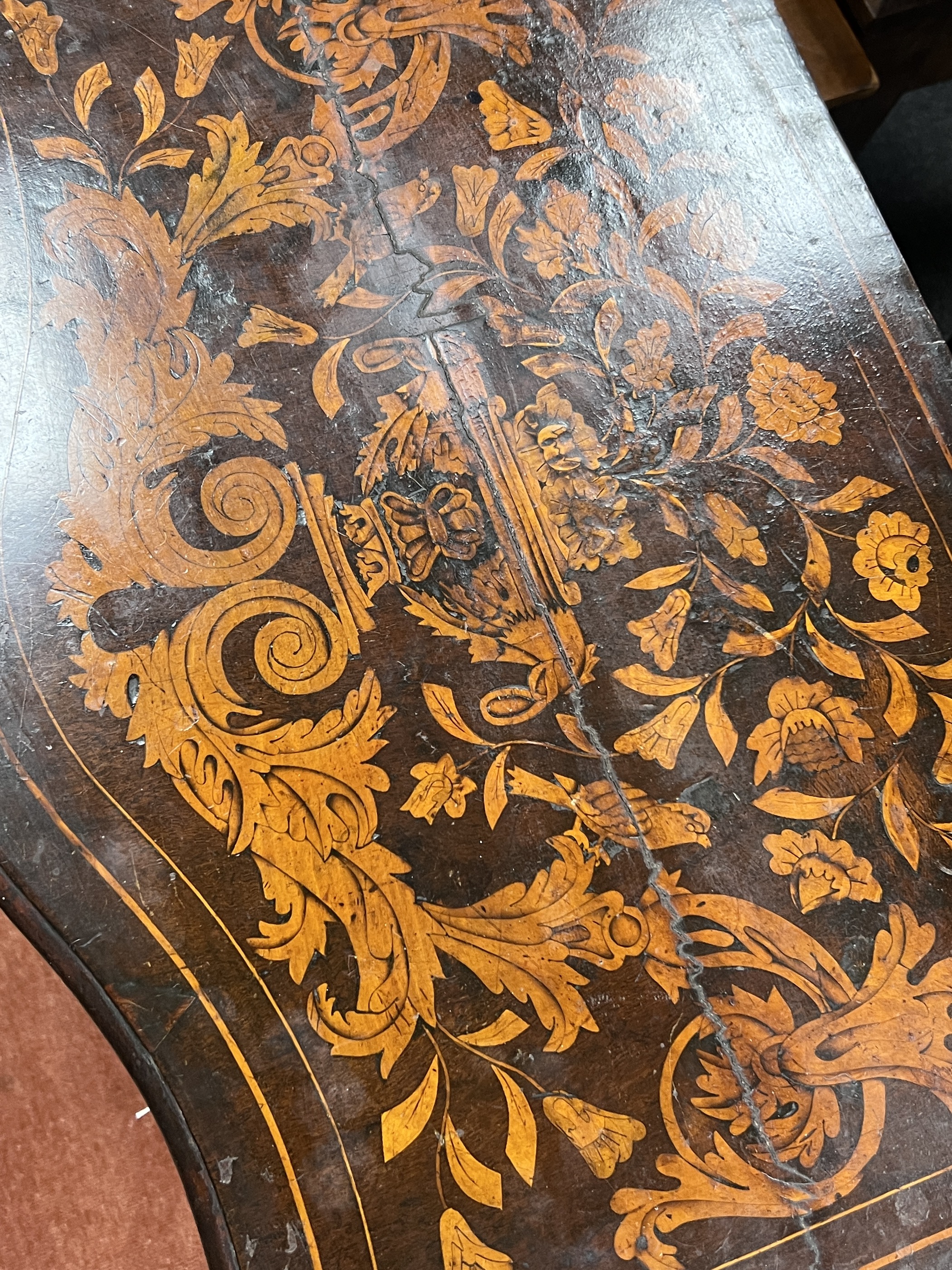 A late 18th century Dutch floral marquetry walnut serpentine side table, width 70cm, depth 45cm, height 74cm